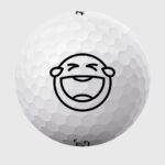 Golfbolde med ansigt der griner